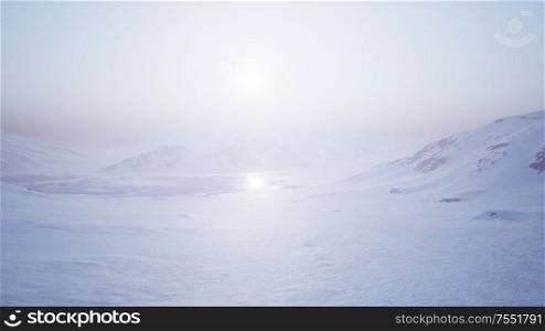 Aerial Landscape of snowy mountains and icy shores in Antarctica