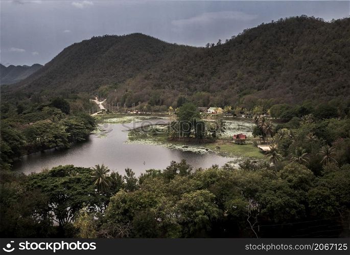 Aerial landscape of swamp lake in the middle of dense green forest the valley. Focus and blur.