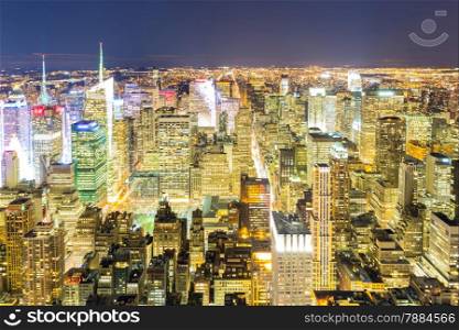 Aerial New York City skyline urban skyscrapers at night, USA.