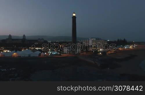 Aerial night view of Gran Canaria Island. Maspalomas Lighthouse at the southern end of the island. Spain