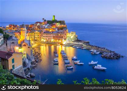 Aerial night view of Vernazza fishing village, seascape in Five lands, Cinque Terre National Park, Liguria, Italy.