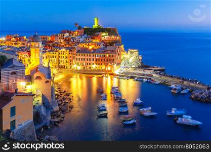 Aerial night view of Vernazza village, seascape in Five lands, Cinque Terre National Park, Liguria, Italy.