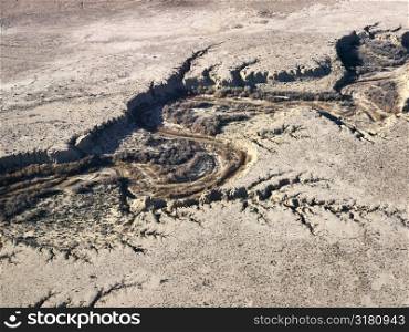 Aerial of Arizona desert landscape with dried riverbed.