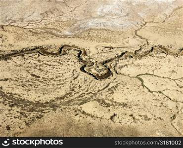 Aerial of Colorado desert landscape with dried riverbed.