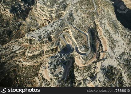 Aerial of curvy road in high desert landscape of Utah, USA.
