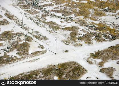 Aerial of dirt road crossroads in rural landscape, California, USA.