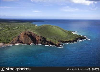 Aerial of Maui, Hawaii coastline with crater and cliffs on Pacific ocean.