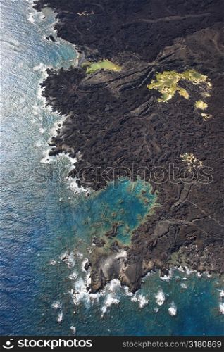 Aerial of Maui, Hawaii coastline with lava rocks.