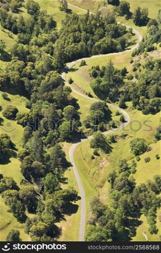 Aerial of road curving through rural landscape, USA.