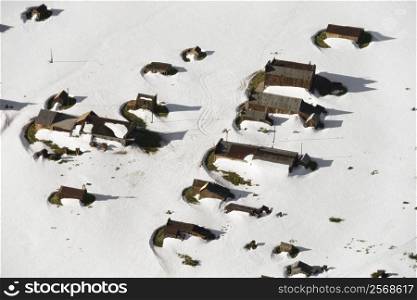 Aerial of snow covered buildings in small town, California, USA.
