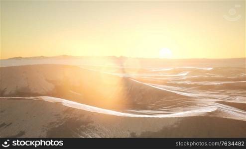 aerial of the red sand desert dunes at sunset. Red Sand Desert Dunes at Sunset