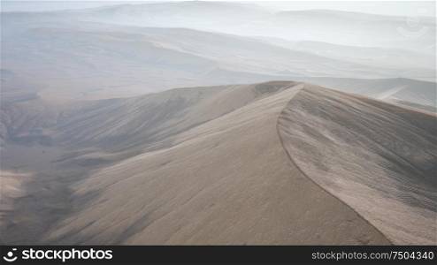 aerial of the red sand desert dunes in fog. Red Sand Desert Dunes in Fog