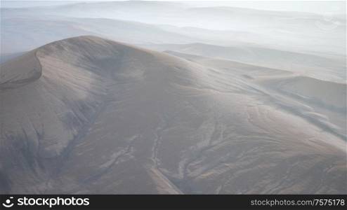 aerial of the red sand desert dunes in fog. Red Sand Desert Dunes in Fog