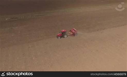Aerial of tractor on harvest field