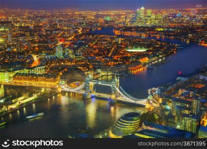 Aerial overview of London city with the Tower bridge at the night time