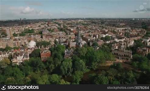 Aerial panorama of Amsterdam with houses, Vondelpark and Vondel Church. Dutch capital