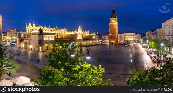 Aerial panorama of Medieval Main market square with Cloth Hall and Town Hall Tower in Old Town of Krakow at night, Poland. Main market square, Krakow, Poland