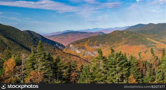 Aerial panorama of Smugglers Notch looking towards the north and away from Stowe in fall colors taken from mountain top. Aerial view of Smugglers Notch in the fall