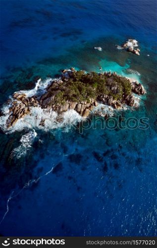 Aerial panorama of the Marine reserve of Coco island with the blue Indian Ocean, Seychelles