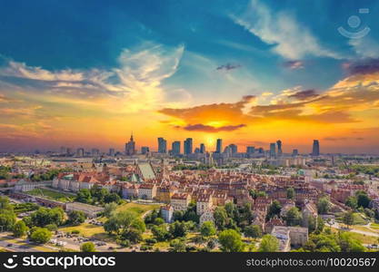 Aerial panorama of Warsaw, Poland  over the Vistual river and City center in a distance. Sunset sky