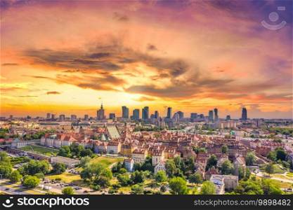 Aerial panorama of Warsaw, Poland  over the Vistual river and City center in a distance. Sunset sky