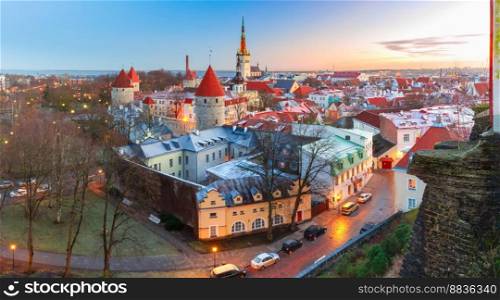 Aerial panoramic cityscape with Medieval Old Town, St. Olaf Baptist Church and Tallinn City Wall in the morning, Tallinn, Estonia. Aerial view of old town in Tallinn, Estonia