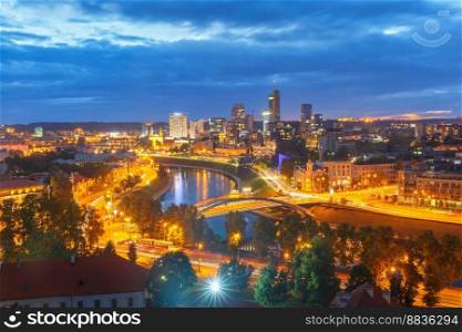Aerial panoramic cityscape with skyscrapers of New Center of Vilnius from Gediminas Tower at night, Lithuania, Baltic states.. Panorama New Center of Vilnius, Lithuania