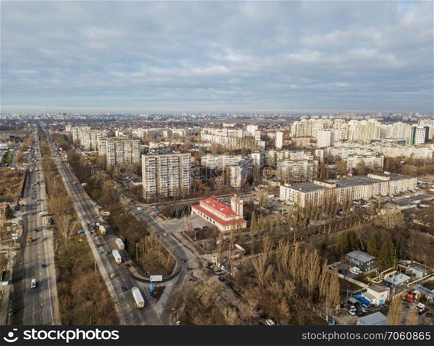 Aerial panoramic photography from the drone, bird&rsquo;s eye view to modern city district with urban infrastructure and residential buildings of the city Kiev.. A bird&rsquo;s eye view, aerial panoramic view from drone to the Darnyts&rsquo;kyi district of Kiev, Ukraine at sunset in the summer.