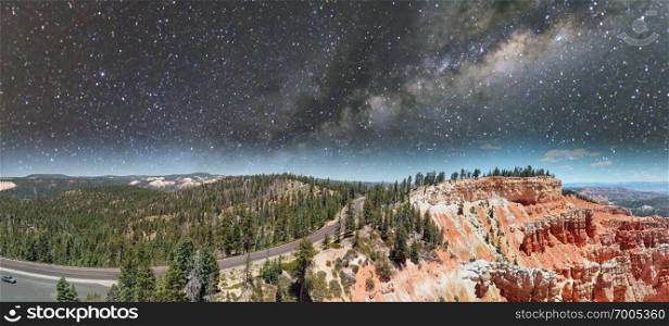 Aerial panoramic view of beautiful canyon on a starry night.