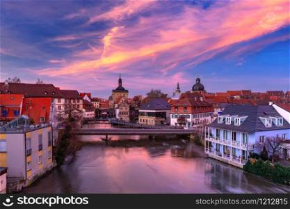 Aerial panoramic view of Old town hall or Altes Rathaus with bridges over the Regnitz river at sunset in Bamberg, Bavaria, Upper Franconia, Germany. Old Town of Bamberg, Bavaria, Germany
