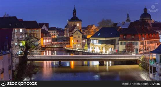 Aerial panoramic view of Old town hall or Altes Rathaus with bridges over the Regnitz river at night in Bamberg, Bavaria, Upper Franconia, Germany. Old Town of Bamberg, Bavaria, Germany