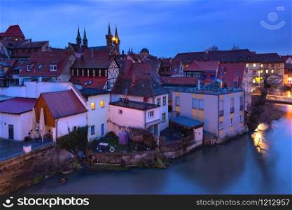 Aerial panoramic view of Old town of Bamberg over the Regnitz river with Michelsberg monastery at night, Bavaria, Upper Franconia, Germany. Old Town of Bamberg, Bavaria, Germany