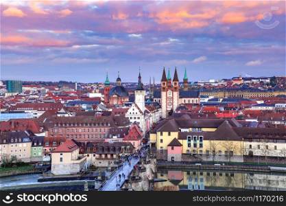 Aerial panoramic view of Old Town with cathedral, city hall, Alte Mainbrucke in Wurzburg at sunset, part of Romantic Road, Franconia, Bavaria, Germany. Wurzburg, Franconia, Northern Bavaria, Germany