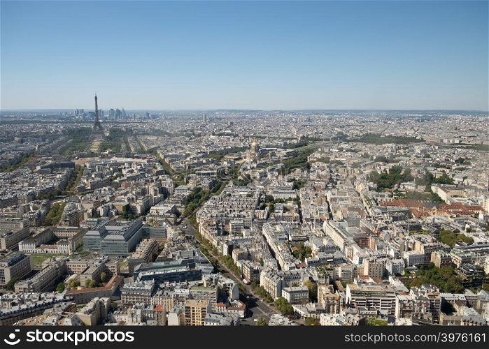 Aerial panoramic view of Paris skyline with Eiffel Tower, Les Invalides and business district of Defense, as seen from Montparnasse Tower, Paris, France