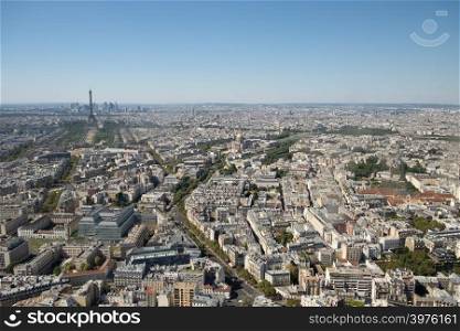 Aerial panoramic view of Paris skyline with Eiffel Tower, Les Invalides and business district of Defense, as seen from Montparnasse Tower, Paris, France