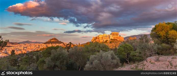 Aerial panoramic view of the Acropolis Hill with Parthenon and Mount Lycabettus at gorgeous sunset in Athens, Greece. Acropolis Hill and Parthenon in Athens, Greece