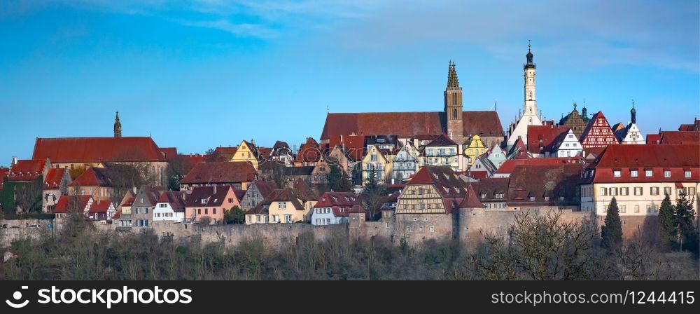 Aerial panoramic view of town wall, quaint colorful facades and roofs of medieval old town of Rothenburg ob der Tauber, Bavaria, Germany. Rothenburg ob der Tauber, Germany