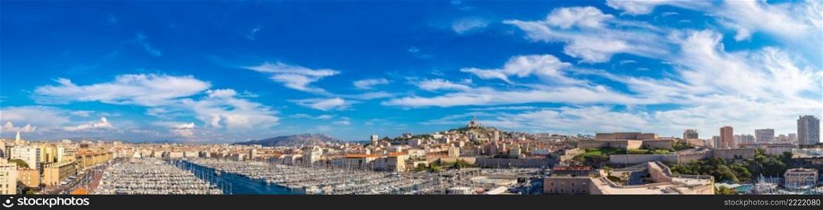 Aerial panoramic view on basilica of Notre Dame de la Garde and old port  in Marseille, France