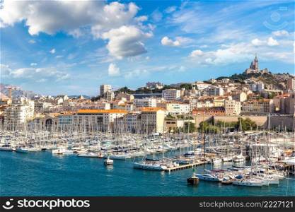 Aerial panoramic view on basilica of Notre Dame de la Garde and old port  in Marseille, France