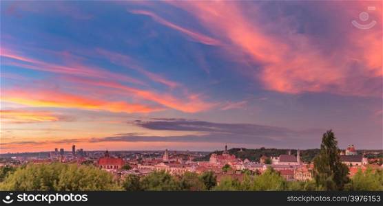 Aerial panoramic view over Old town of Vilnius and skyscrapers of New Center, Lithuania at beautiful sunrise, Baltic states.. Panorama of Old town, Vilnius, Lithuania