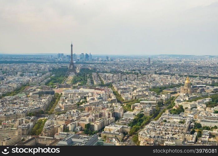 Aerial panormic view of Paris skyline with Eiffel Tower, Les Invalides and business district of Defense, as seen from Montparnasse Tower, Paris, France