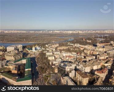 Aerial photo of the architecture of Kiev central part with the building of the Ministry of Internal Affairs and the Mikhailovsky Church. In the distance Hydropark, Ukraine. Aerial view of the central part of Kiev and Hydropark and left bank district, Ukraine
