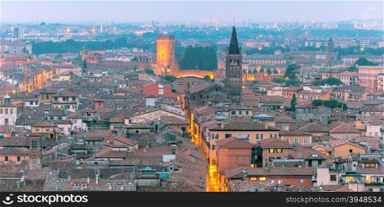 Aerial scenic panorama of Verona skyline with Castelvecchio at night, view from Piazzale Castel San Pietro, Italy