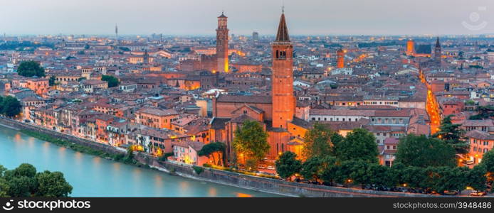 Aerial scenic panorama of Verona skyline with river Adige, Santa Anastasia Church and Torre dei Lamberti or Lamberti Tower at evening, view from Piazzale Castel San Pietro, Italy