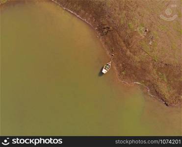 Aerial shot of boat at Veer Dam, Pune, Maharashtra, India