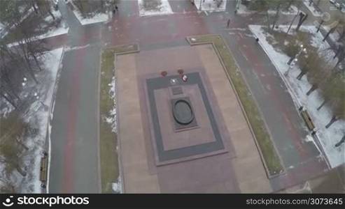 Aerial shot of eternal fire and marble stele on the Square of Fallen Soldiers in Volgograd, Russia. Monument in memory of Battle of Stalingrad