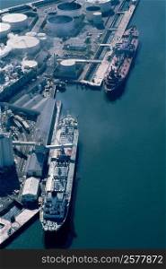 Aerial shot of ships at an oil refinery