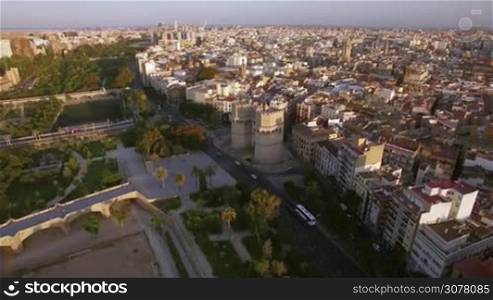 Aerial shot of Valencia with view to Serranos Towers, historical landmark of the city. Gate built in Valencian Gothic style between 1392 and 1398, Spain