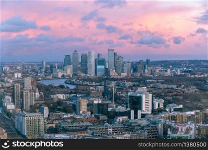 Aerial sunset cityscape of London and the River Thames with Canary Wharf in the background