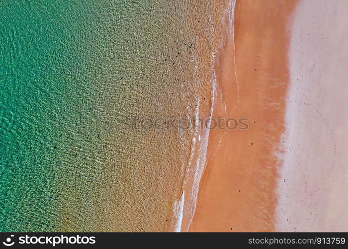 Aerial top shot from ocean waves at the beach